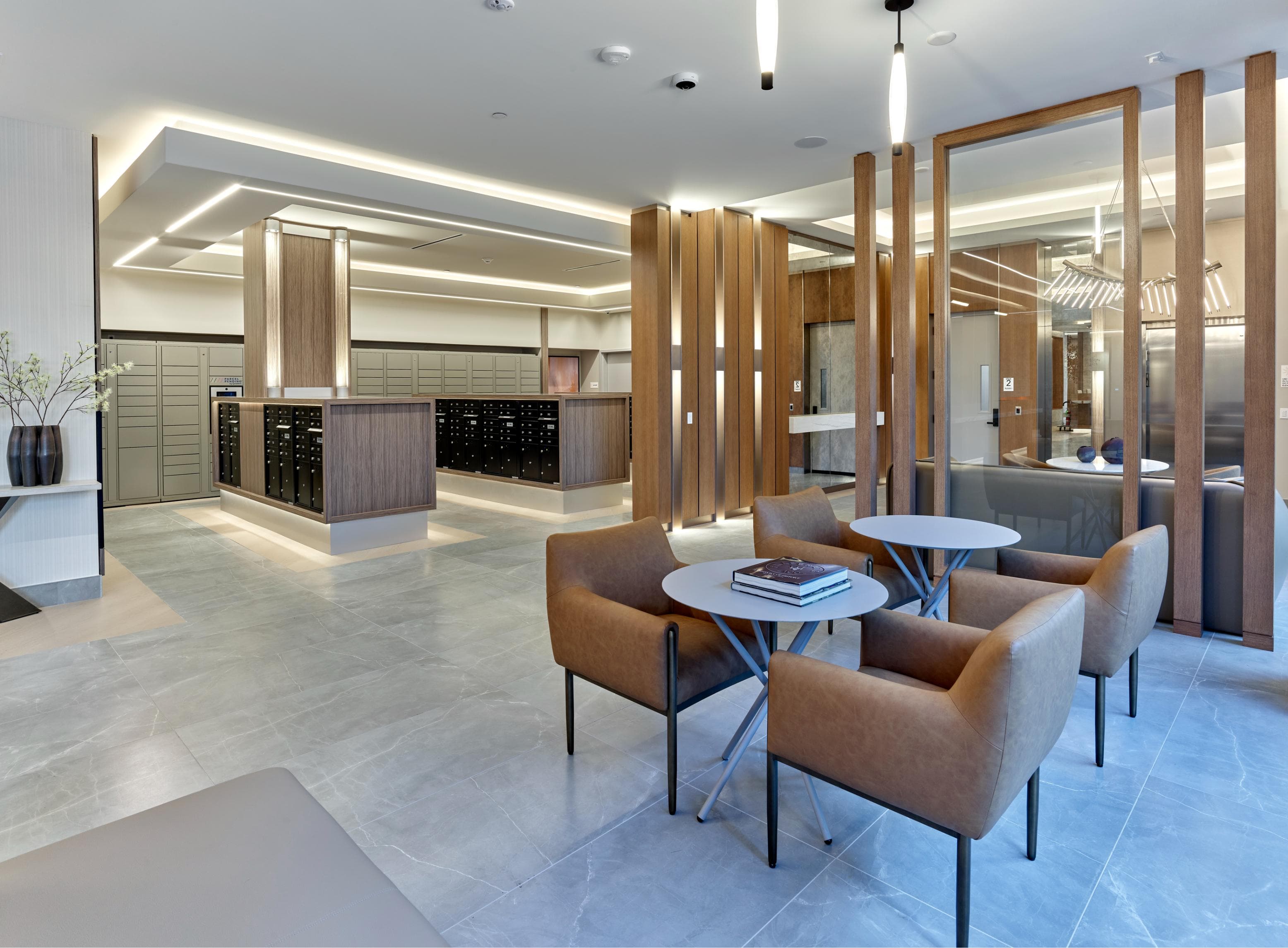 A modern lobby with concierge in a luxury apartment community