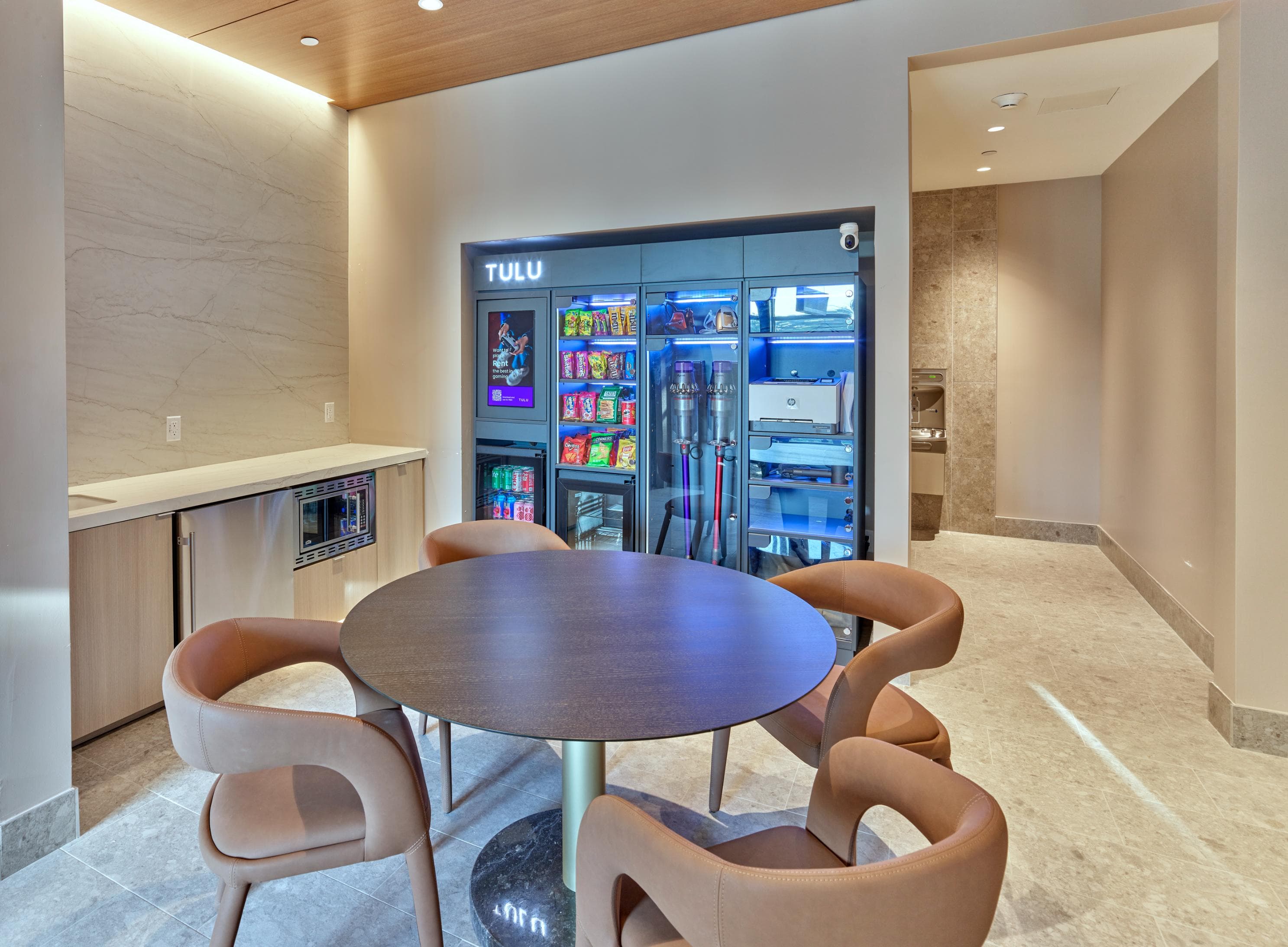 TULU vending machines for easy access to rent vacuums, purchase snacks, and other conveniences in private business center.