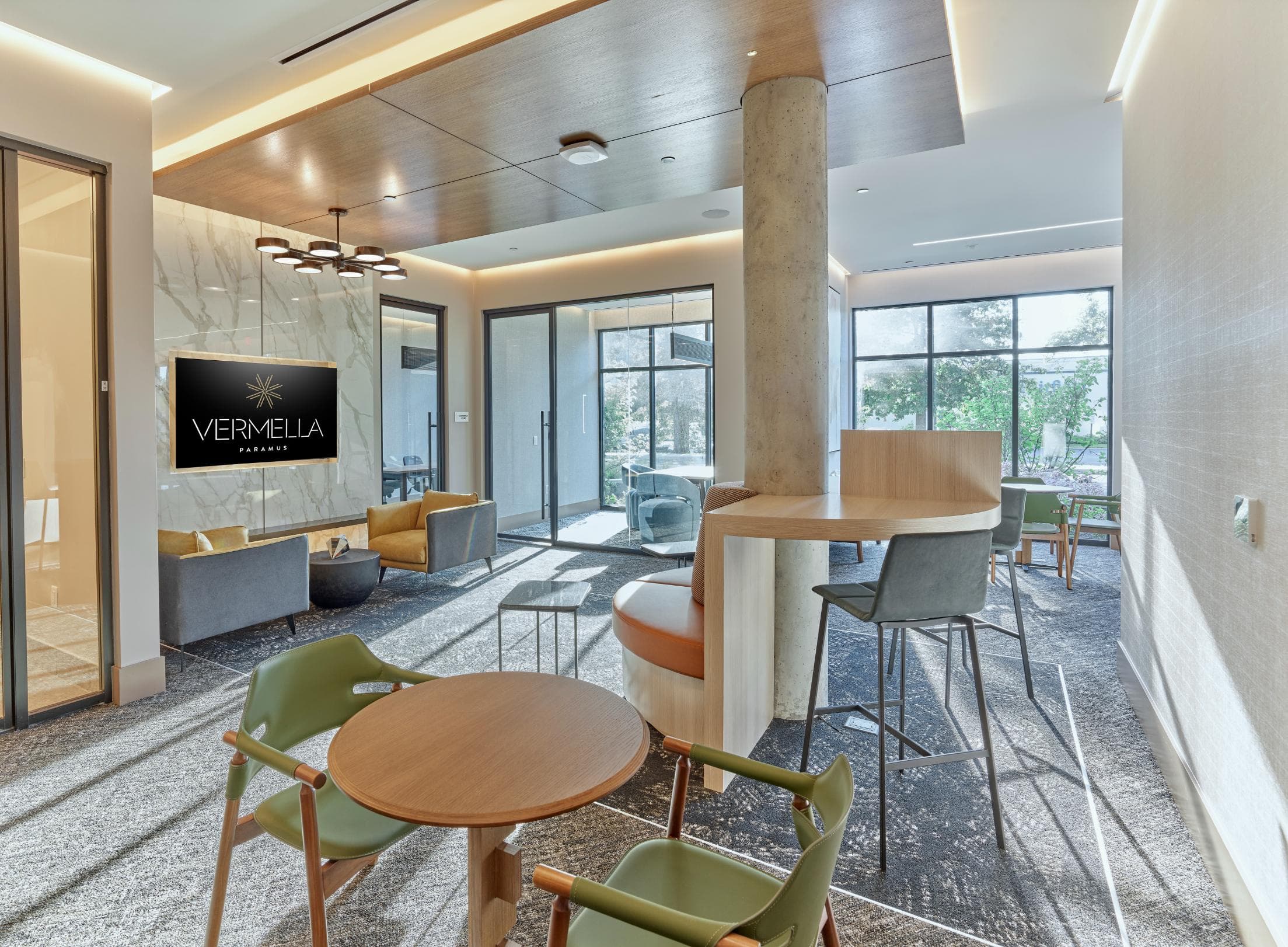 A modern office space with a wooden table and chairs.